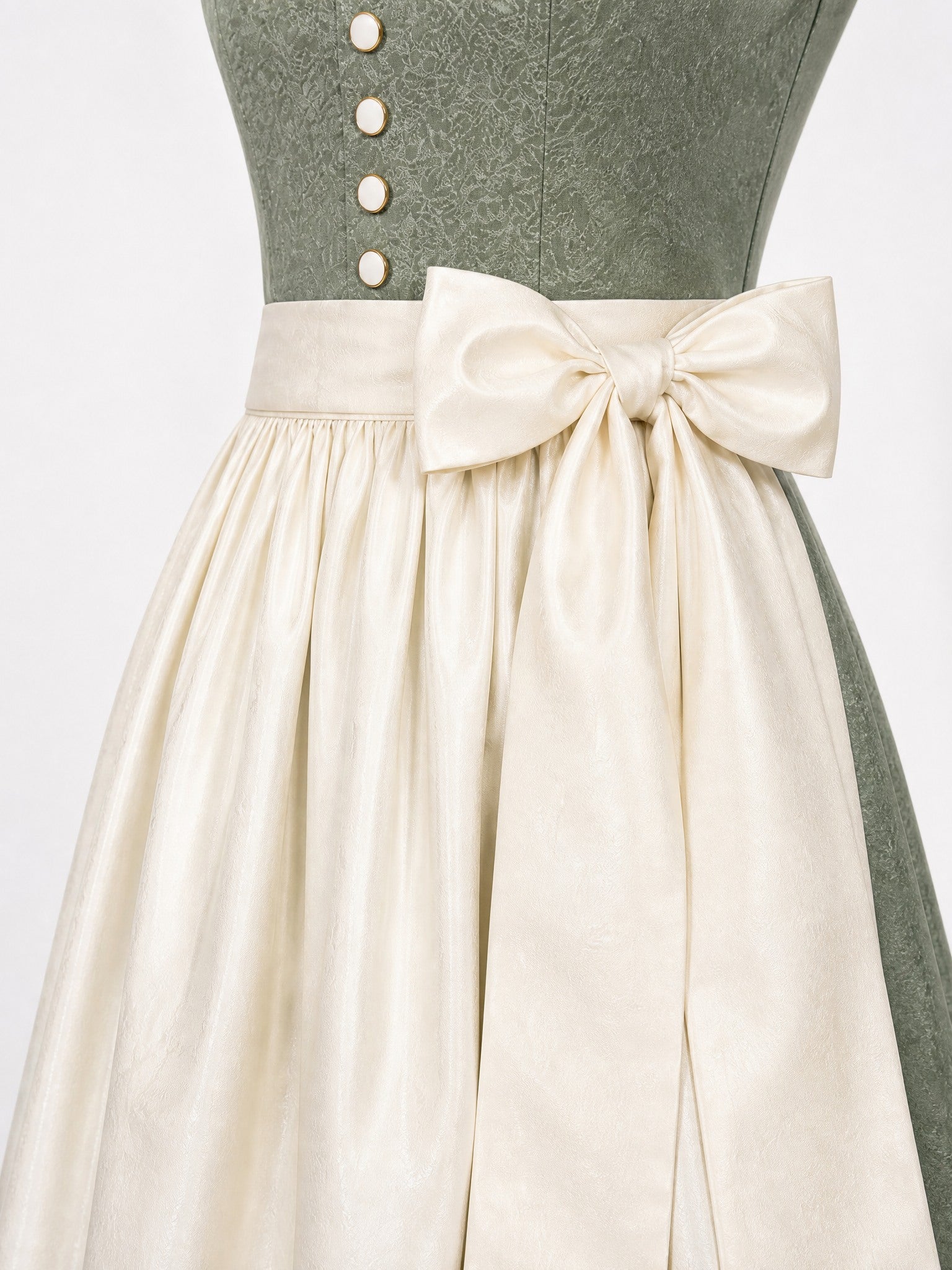 Dirndl Romy in Mineralgrün mit Elfenbein Schürze - Detailansicht Taille und Schleife